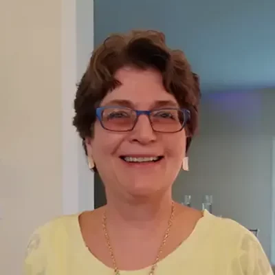 Dr. Jean Gibson, Doctor of Chiropractic, knee pain specialist using FDA-cleared Knee on Trac therapy for non-surgical arthritis treatment in Fayetteville Arkansas